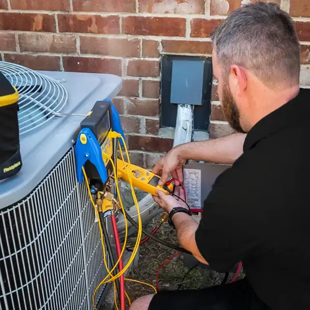 Owner and operator, Steven Sherrell, provides quality AC repair on an HVAC unit in Houston.